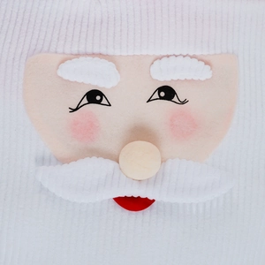 Macro detail of Santa Claus toilet seat cover featuring 3D felt nose and textured fabric