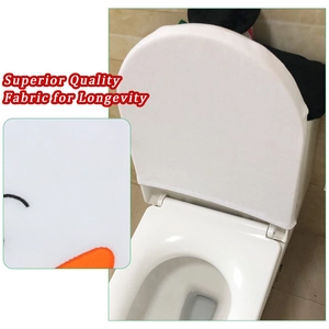 Macro view of snowman toilet cover showing thick white plush fabric and embroidery