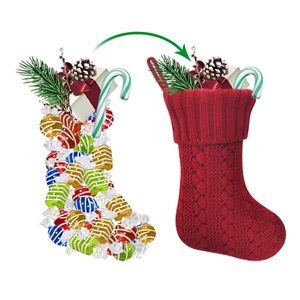 Red cable knit Christmas stocking for fireplace hanging and holiday gift filling