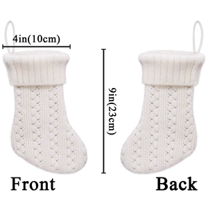 White knitted Christmas stocking with cable stitch pattern and dimensions for holiday decor
