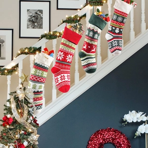 Set of 4 knitted Christmas stockings with reindeer and snowflake patterns for holiday decor