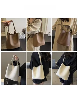 Detailaufnahmen von französischen Vintage-Beuteltaschen aus braunem und weißem Leder