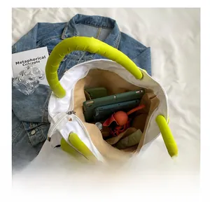 Top view showing the spacious interior and compartments of this white tote bag