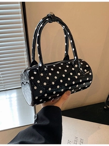 French retro polka dot Boston handbag in glossy black patent leather with twin handles