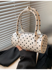 Polka dot Boston handbag in white patent leather with stylish round top handles