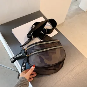 Detail show of camouflage crossbody bag with dual zippers and fashion decorative straps