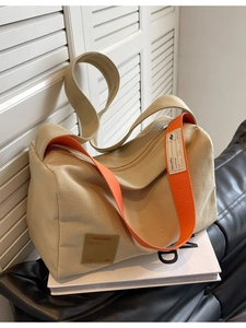 Fashionable khaki canvas pillow bag with wide orange strap and high-capacity casual design