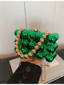 Chic green acrylic evening clutch bag with gold round handle and chain strap