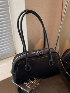 Vintage black canvas baguette bag with contrast white stitching and double handles