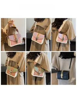 Macro details of trendy small square bags with vibrant color blocking and gold chain