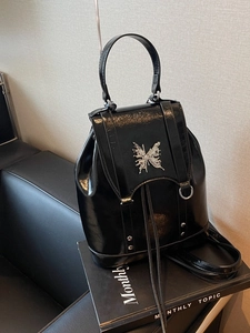Retro black patent leather Y2K backpack with silver butterfly metal ornament