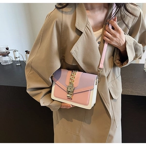Detail of tricolor拼接 PU leather crossbody bag with bold gold chain and buckle closure