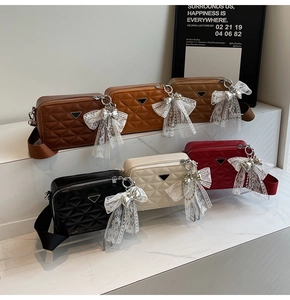 Quilted camera bags in six colors with lace bow charms and wide woven straps