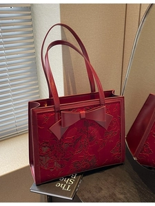 Elegant wine red bridal handbag with lace embroidery and large leather bow detail