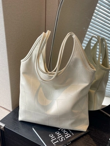 Chic ivory faux leather tote bag with geometric patchwork and long double handles