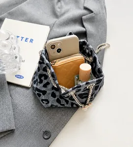 Top view of cow print bucket bag showing interior space for phone and perfume