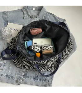 Interior view showing spacious capacity of geometric tote bag with daily essentials