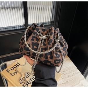 Detail of leopard print bucket bag with metal chain strap and pearl drawstring charms