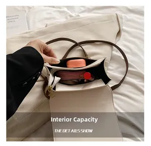 Detail view of the spacious inner compartment showing makeup and lipstick storage