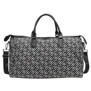 Large travel tote bag with geometric pattern, black leather handles and shoulder strap