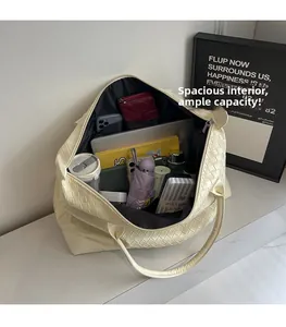 Macro view of woven tote bag interior showing large capacity and multi-pocket lining
