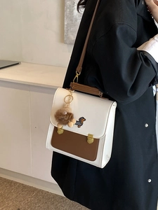 Fashionable two-tone backpack with dachshund embroidery and plush charm for travel