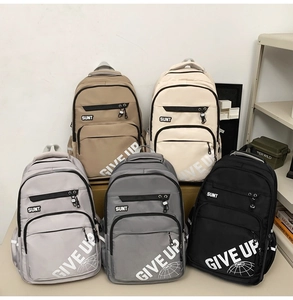 Five school backpacks in neutral tones showing large capacity and SUNT prints
