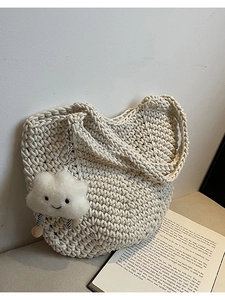 Chic hollow woven shoulder bag in beige with cute plush cloud pendant for daily styling