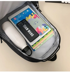 Interior view showing the large capacity main compartment of this black backpack
