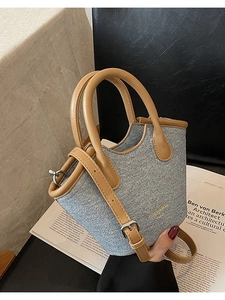 Denim and brown leather bucket bag with top handle and crossbody strap minimalist style