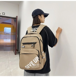 Detailed side view of khaki nylon backpack with SUNT and GIVE UP prints for students