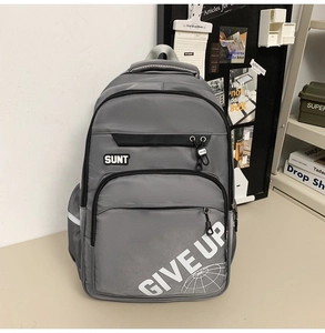Close-up of grey large capacity backpack featuring SUNT logo and GIVE UP graphic print