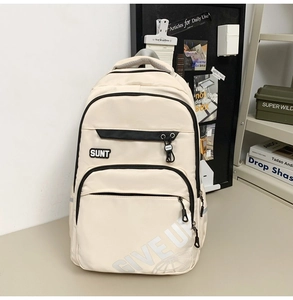 Detail view of large capacity cream white school backpack with functional zippers and side buckles