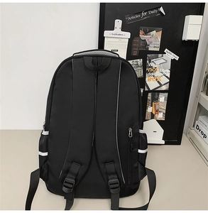 Detail of the black backpack back with padded S-straps and hidden side zipper pocket