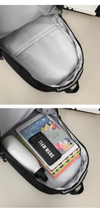 Detail view of large capacity interior compartment and tablet pocket in black backpack