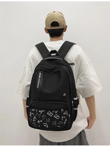 Close-up of black backpack featuring reflective side strips and racing strap details