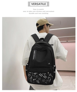 Detailed view of black waterproof nylon backpack with white prints and racing straps