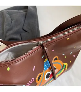 Detailed view of the smooth metal zipper and gray herringbone lining of the burger tote bag