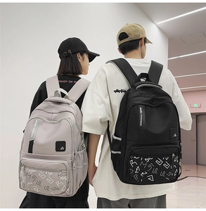 Rear view of light gray and black waterproof backpacks with reflective safety strips