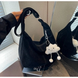 Minimalist black faux suede Hobo shoulder bag with adjustable strap and cloud charm