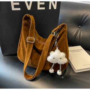 Brown faux suede hobo shoulder bag with a cute white cloud plush charm and wide strap