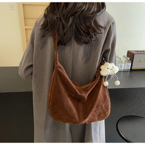 Brown suede hobo tote bag with plush cloud charm shown from a back-view perspective