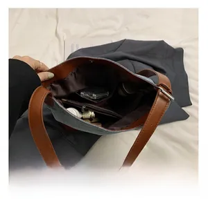 Interior view of contrast color bucket bag showing zipper pocket and large capacity