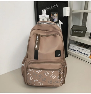 Brown water-resistant nylon backpack with multiple compartments and side pockets
