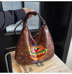 Brown PU leather burger tote bag featuring retro cartoon print on a cookbook backdrop