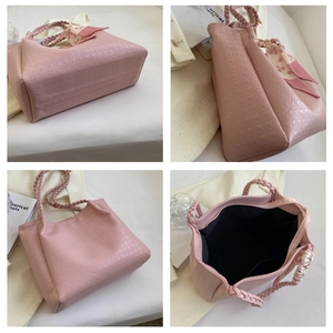 Pink PU leather tote bag details with star embossing and woven strap featuring cherry scarf