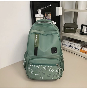 Detailed view of green multi-pocket backpack with RACING webbing and durable zipper