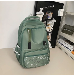 Detail view of olive green backpack with Racing ribbon and durable nylon fabric texture