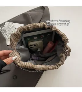Spacious interior of striped canvas bucket bag showing large capacity for essentials