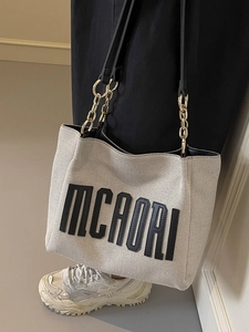 Chic canvas tote bag with MCAORI embroidery and elegant metal chain shoulder strap